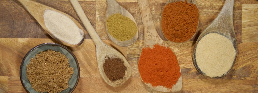 spices on wooden spoons