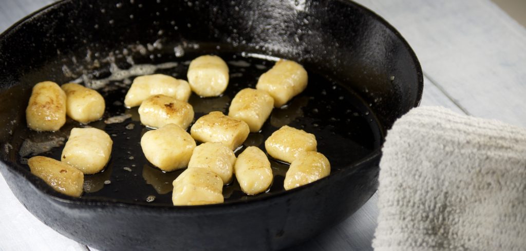 gnocchi cooking in cast iron pan