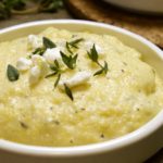 Creamy Goat Cheese Polenta garnished with Goat Cheese and Thyme