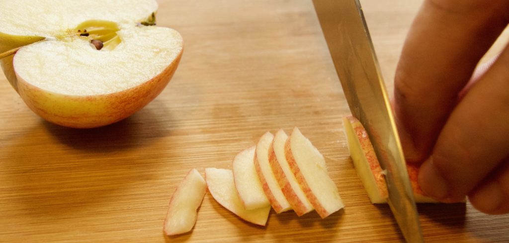 Apple quartered and thinly sliced