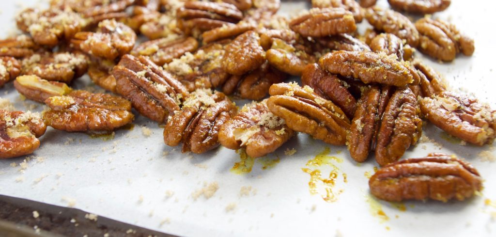 Candied Pecans with Turmeric, raw on baking sheet