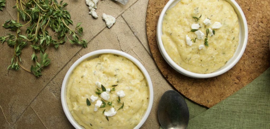 Creamy Goat Cheese Polenta garnished with Goat Cheese and Thyme