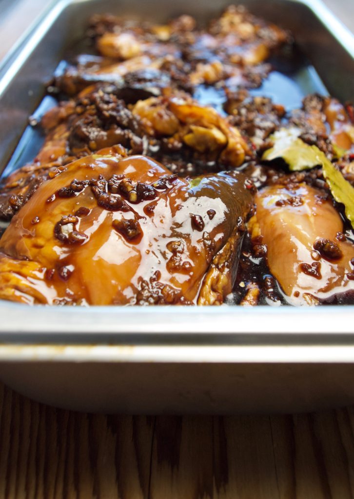 Adobo chicken marinade in a tray