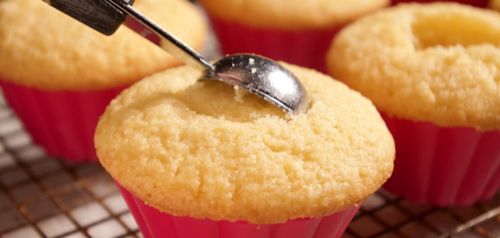 Almond Cupcakes getting scooped out