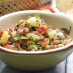 pineapple salsa in a bowl with chips